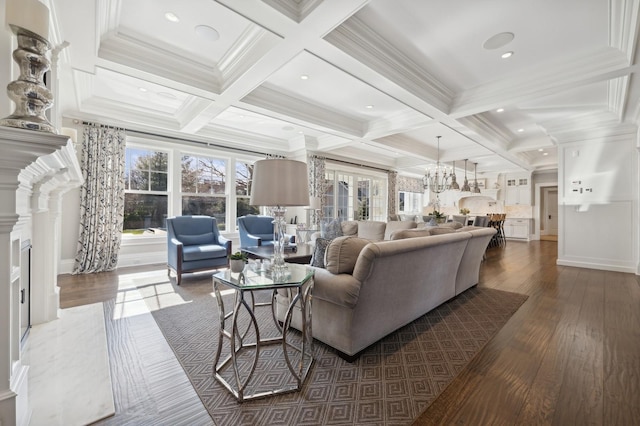 living room with dark wood finished floors, a wealth of natural light, and coffered ceiling