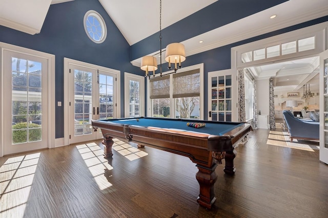 game room featuring wood finished floors, a wealth of natural light, crown molding, and pool table