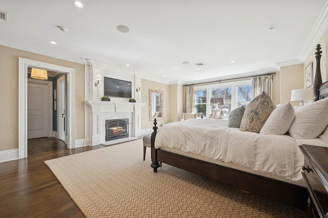 bedroom featuring recessed lighting, a fireplace, baseboards, visible vents, and dark wood-type flooring