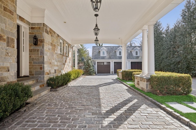 view of patio / terrace with covered porch and decorative driveway