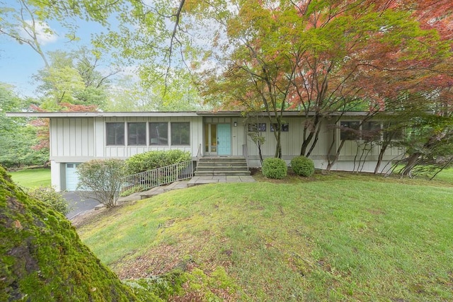 14 Wesley Ct, Congers, NY 10920 - view of front facade featuring a front yard and board and batten siding