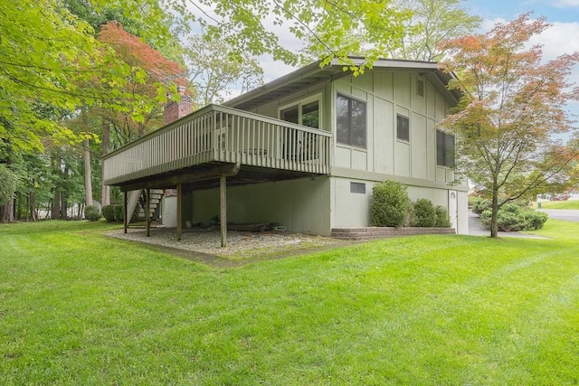 14 Wesley Ct, Congers, NY 10920 - view of home's exterior featuring stairway, board and batten siding, a deck, and a lawn
