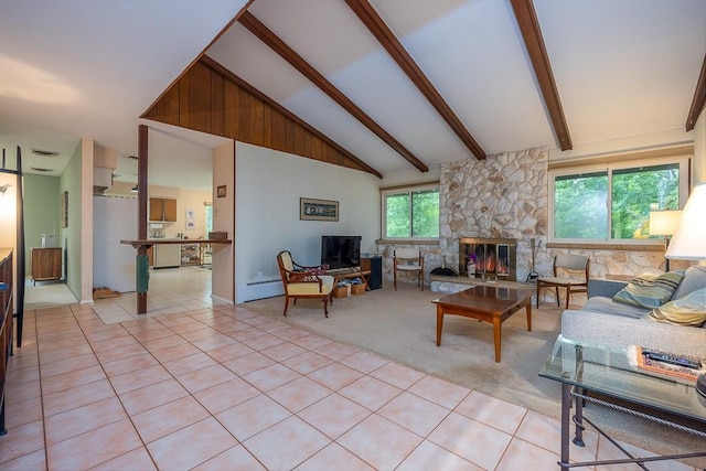 14 Wesley Ct, Congers, NY 10920 - living area with a stone fireplace, light tile patterned flooring, and a baseboard radiator