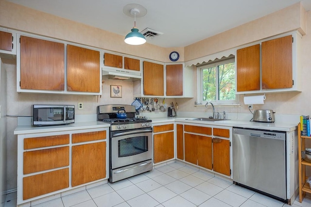 14 Wesley Ct, Congers, NY 10920 - kitchen featuring appliances with stainless steel finishes, a sink, under cabinet range hood, and light countertops