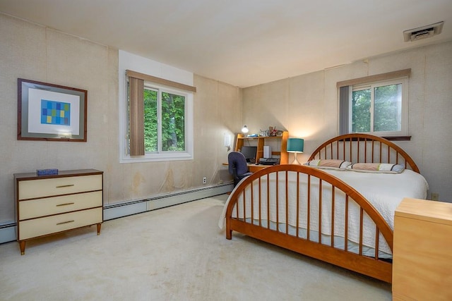 14 Wesley Ct, Congers, NY 10920 - bedroom with baseboard heating, multiple windows, carpet, and an office area