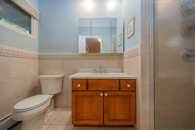 14 Wesley Ct, Congers, NY 10920 - full bath featuring tile walls, a baseboard heating unit, toilet, vanity, and a stall shower