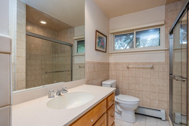 14 Wesley Ct, Congers, NY 10920 - full bathroom with a baseboard radiator, tile walls, toilet, a shower stall, and vanity