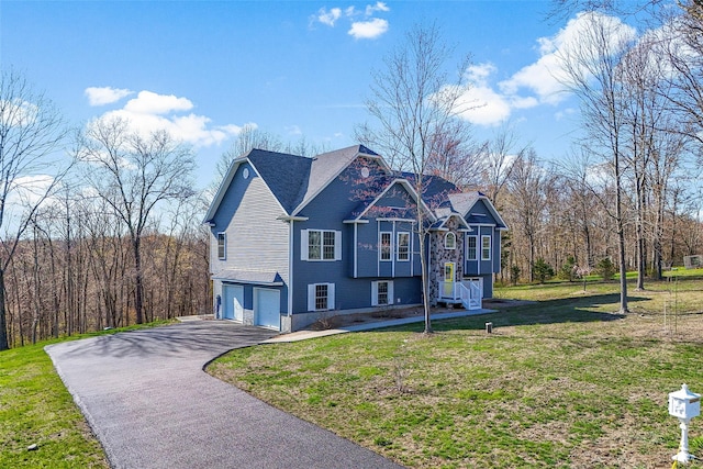 12 Hill Rd, Washingtonville, NY 10992 - view of front facade with driveway, a front yard, and a garage