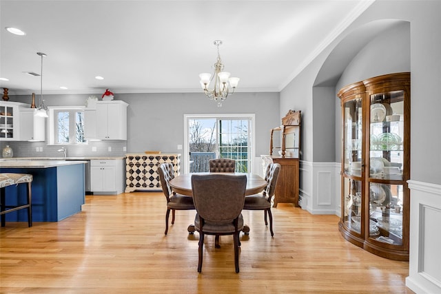 12 Hill Rd, Washingtonville, NY 10992 - dining area featuring a chandelier, ornamental molding, a healthy amount of sunlight, and light wood-style floors
