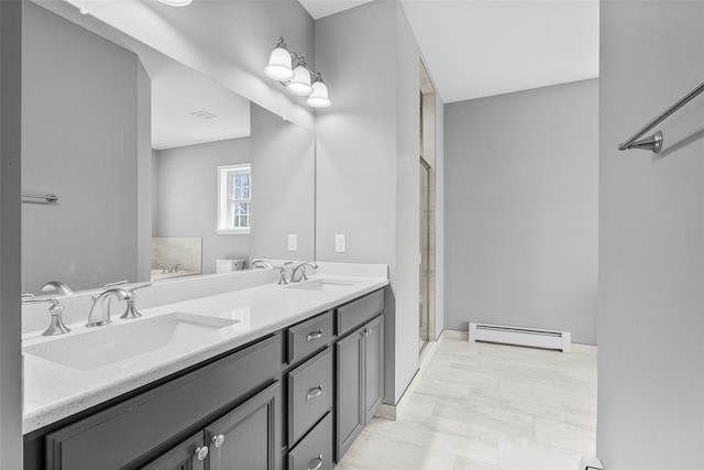 12 Hill Rd, Washingtonville, NY 10992 - full bath featuring double vanity, a shower stall, baseboard heating, and a sink