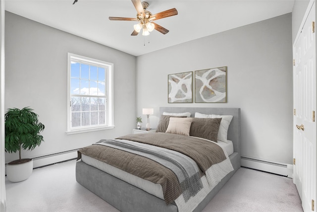12 Hill Rd, Washingtonville, NY 10992 - bedroom featuring a baseboard heating unit, a ceiling fan, carpet flooring, and baseboard heating