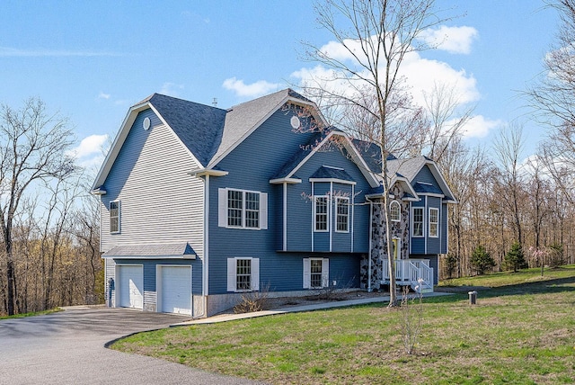 12 Hill Rd, Washingtonville, NY 10992 - split foyer home with a front yard, aphalt driveway, and a garage