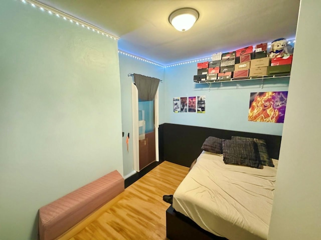 bedroom featuring wood finished floors
