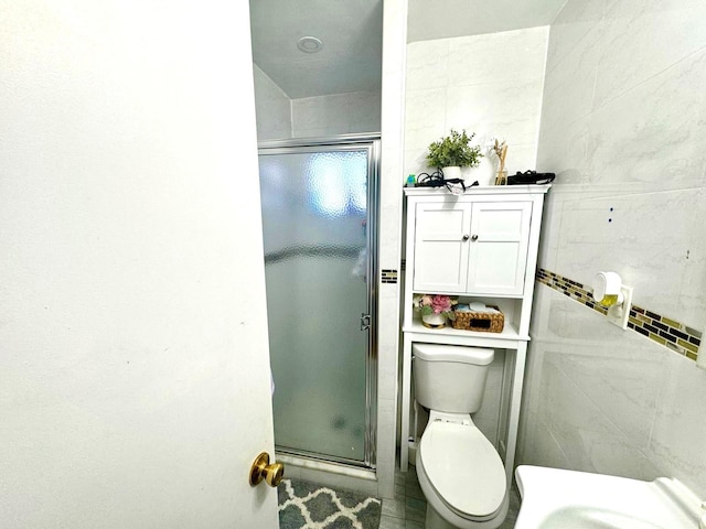 full bathroom with toilet and a shower stall