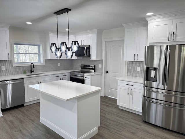 kitchen featuring white cabinetry, dark wood-style floors, stainless steel appliances, and a sink