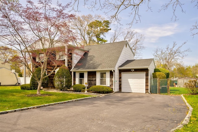 5 Cottonwood Ave, Port Jefferson Station, NY 11776 - view of front of property with a front lawn, driveway, a shingled roof, an attached garage, and fence