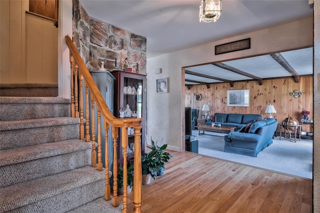 5 Cottonwood Ave, Port Jefferson Station, NY 11776 - staircase with beam ceiling, wood finished floors, and wooden walls