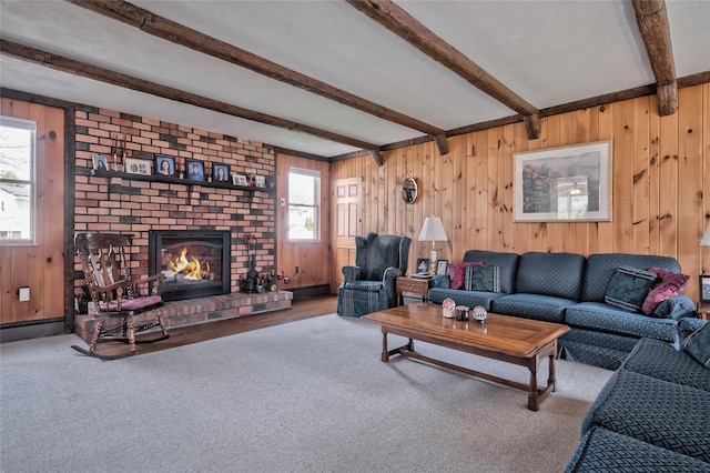 5 Cottonwood Ave, Port Jefferson Station, NY 11776 - carpeted living area with beamed ceiling, a wealth of natural light, and a fireplace