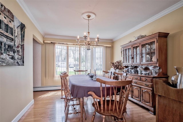 5 Cottonwood Ave, Port Jefferson Station, NY 11776 - dining space with a notable chandelier, a baseboard heating unit, light wood-style flooring, baseboards, and ornamental molding