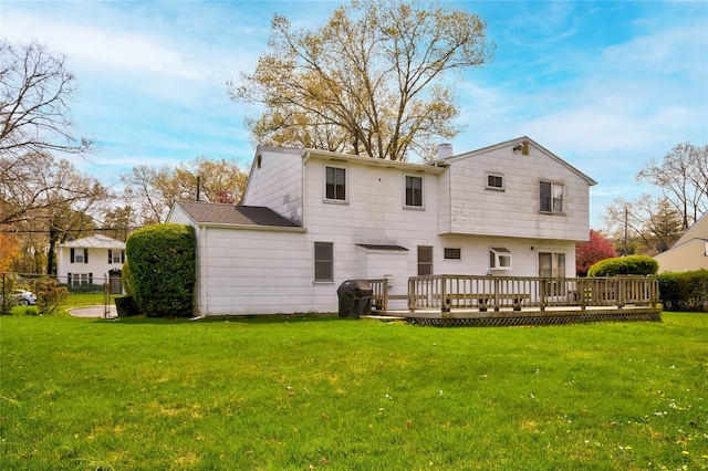 5 Cottonwood Ave, Port Jefferson Station, NY 11776 - back of property with a wooden deck, a lawn, a chimney, and fence