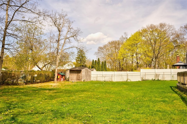 5 Cottonwood Ave, Port Jefferson Station, NY 11776 - view of yard featuring a storage shed, a fenced backyard, and an outdoor structure