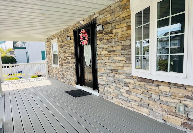 wooden deck featuring covered porch