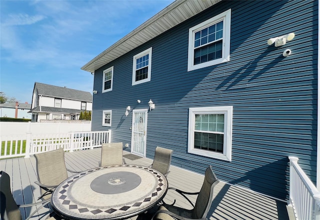 deck featuring fence and outdoor dining area