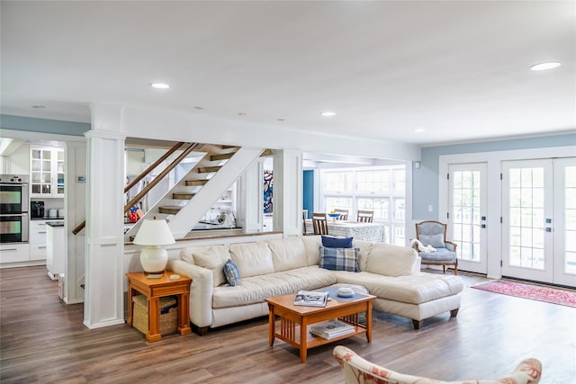 2 Spring Hollow Rd, Centerport, NY 11721 - living area featuring wood finished floors, decorative columns, stairway, and recessed lighting