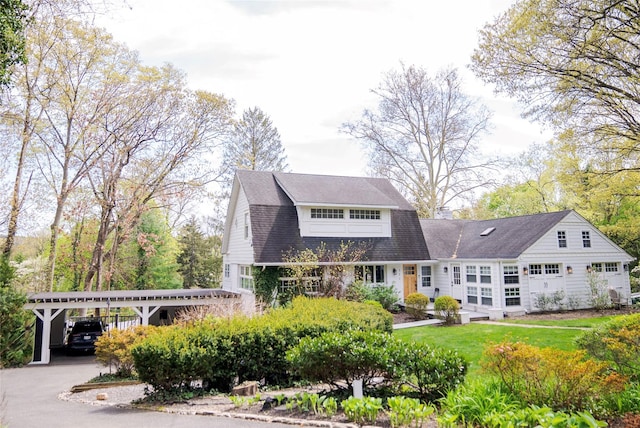 2 Spring Hollow Rd, Centerport, NY 11721 - rear view of property with a lawn and a detached carport