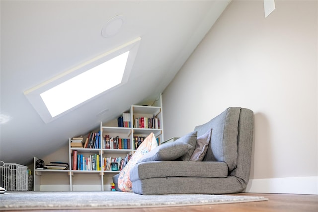 2 Spring Hollow Rd, Centerport, NY 11721 - sitting room with a skylight, vaulted ceiling, and wood finished floors