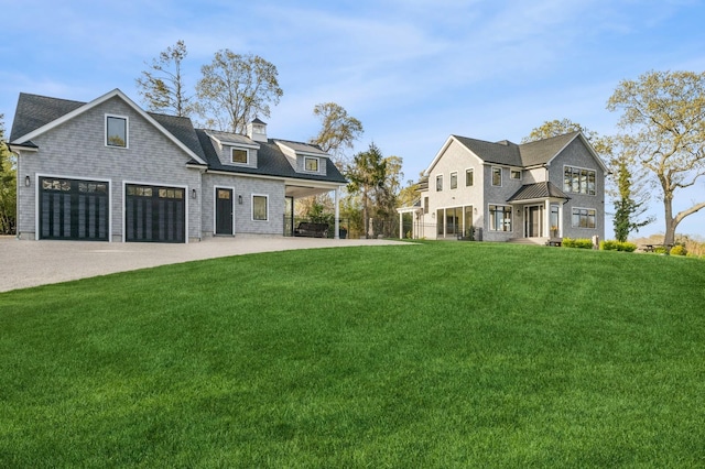 modern farmhouse with a front lawn and concrete driveway