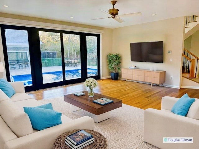 living room with ceiling fan, stairs, recessed lighting, baseboards, and wood finished floors