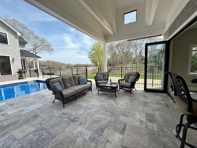view of patio / terrace with an outdoor living space, fence, and a fenced in pool