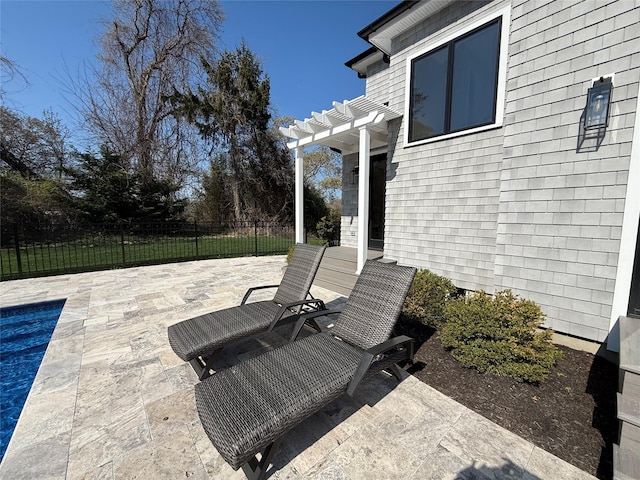 view of patio featuring a fenced in pool, fence, and a pergola