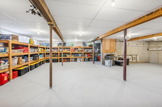 finished below grade area with a drop ceiling