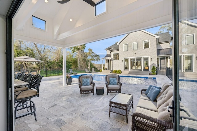 view of patio / terrace with fence, outdoor lounge area, and a fenced in pool