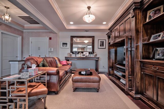 living area featuring light carpet, crown molding, visible vents, and a raised ceiling