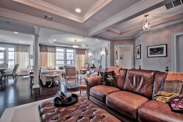 living room featuring wood finished floors, visible vents, and a wealth of natural light
