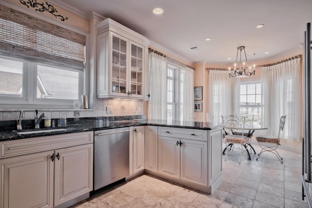 kitchen with crown molding, stainless steel dishwasher, a sink, and a healthy amount of sunlight