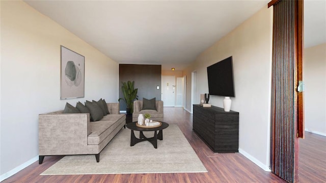 66-36 Yellowstone Blvd Unit 21C, Forest Hills, NY 11375 - living room featuring dark wood-type flooring and baseboards