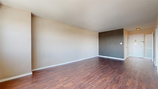 66-36 Yellowstone Blvd Unit 21C, Forest Hills, NY 11375 - unfurnished room with baseboards and dark wood-type flooring
