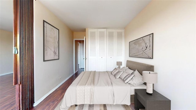 66-36 Yellowstone Blvd Unit 21C, Forest Hills, NY 11375 - bedroom featuring a closet, baseboards, and wood finished floors