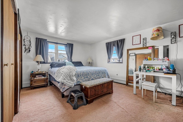 bedroom with light carpet and baseboard heating