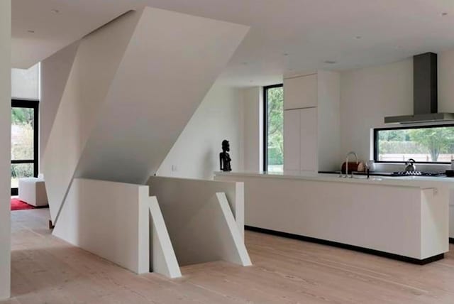 bonus room with a sink and light wood-type flooring