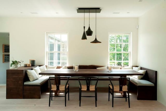 dining room featuring visible vents, wood finished floors, and breakfast area