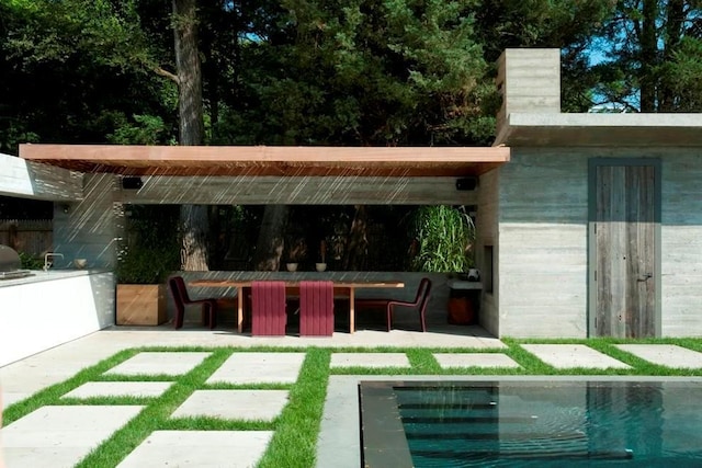 exterior space featuring a patio and an outdoor pool