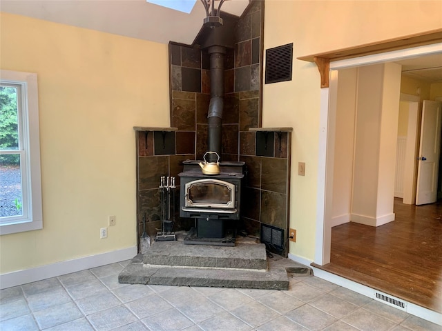 781 Pine Island Tpke, Warwick, NY 10990 - room details with a wood stove, baseboards, and visible vents
