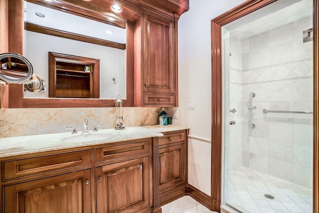 full bath featuring a stall shower and vanity