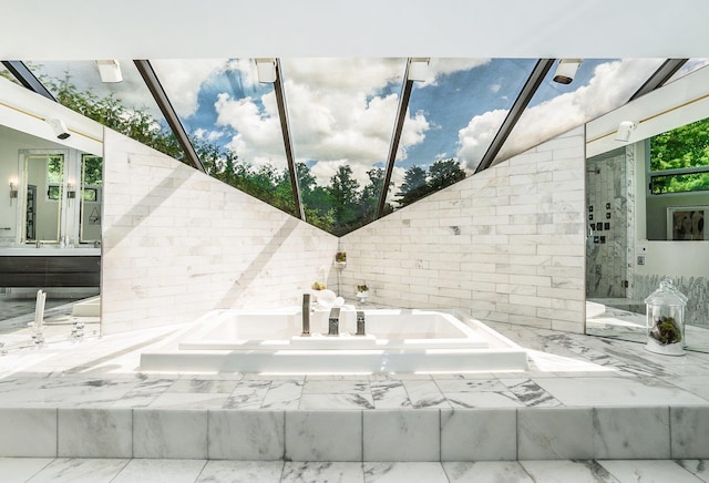bathroom with a bath, a shower stall, and vanity