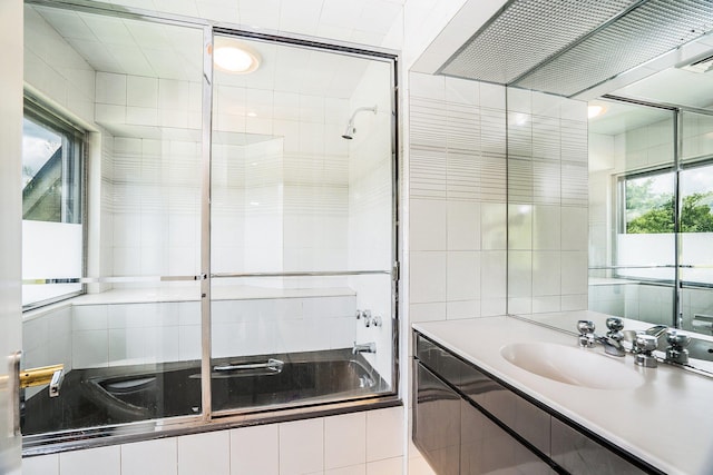 full bathroom with vanity and tiled shower / bath combo
